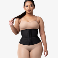 Latex waist trainer paired with Commando bodysuit shapewear for defined hourglass figure